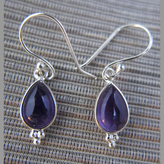 Sterling silver and amethyst drop earrings.