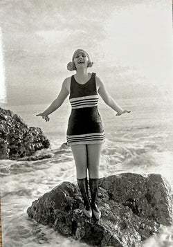 SINGLE CARD - A flapper in her bathing suit on a rock, 1922